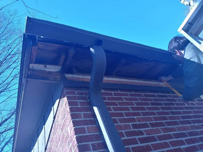 A gutter that has come apart, and an exposed underside of the roof
