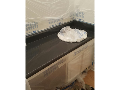 A glossy black bathroom counter