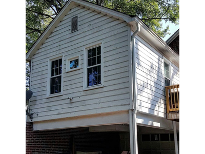 A house with dirty, worn-out siding