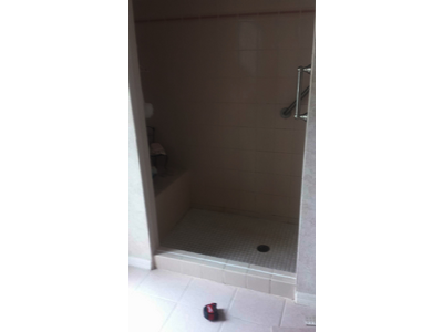 Entrance to a shower with a high curb